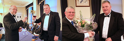 Pictured left: Ellis Wilkinson (left) concludes the master’s song with a toast to Gowan. Pictured right: Gowan (right) presents Stewart with a bouquet for his wife Val. Pictured left: Ellis Wilkinson (left) concludes the master’s song with a toast to Gowan. Pictured right: Gowan (right) presents Stewart with a bouquet for his wife Val.