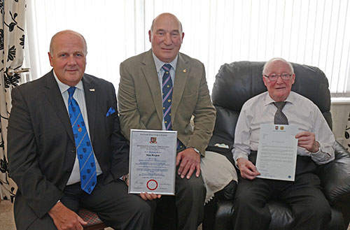 David (left) congratulates John on his achievement. David (left) congratulates John on his achievement.