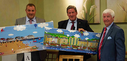 Jim is presented with a pair of paintings to mark his retirement by Neil McGill (centre) and Scott Devine (left) Jim is presented with a pair of paintings to mark his retirement by Neil McGill (centre) and Scott Devine (left)