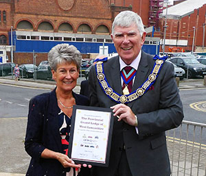 Tony Harrison and his wife Maureen with the certificate of recognition from Lifelites. Tony Harrison and his wife Maureen with the certificate of recognition from Lifelites.