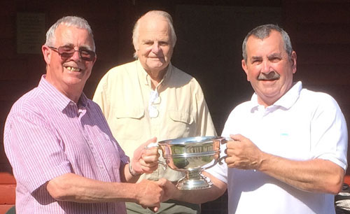 Geoffrey (left) presents the trophy to winner John Bimpson with Len Hart behind. Geoffrey (left) presents the trophy to winner John Bimpson with Len Hart behind.