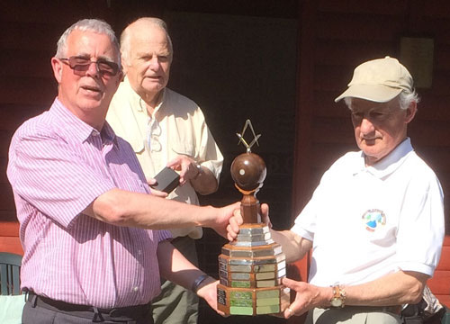 Geoffrey congratulates runner up and defending champion John Cooper closely watched by Len. Geoffrey congratulates runner up and defending champion John Cooper closely watched by Len.