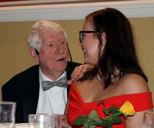 Norman (left) presenting a rose to Alice. Norman (left) presenting a rose to Alice.