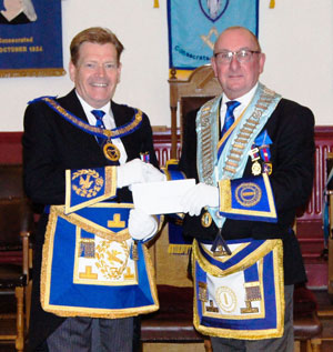 Neil Pedder (right) presenting the cheque to Kevin Poynton. Neil Pedder (right) presenting the cheque to Kevin Poynton.
