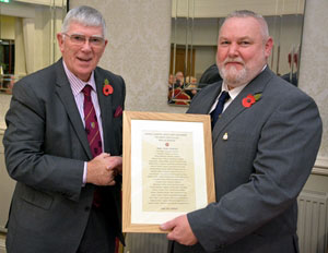 Tony Harrison (left) receiving the roll of honour from Gary Smith. Tony Harrison (left) receiving the roll of honour from Gary Smith.