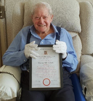 Tom Clark and his 50-year certificate. Tom Clark and his 50-year certificate.