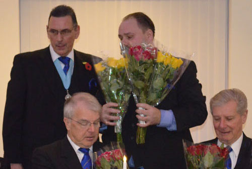 David and Stuart (seated) receive gifts from Eddie and Ezra (standing). David and Stuart (seated) receive gifts from Eddie and Ezra (standing).