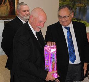Pictured from left to right, are: Gary Smith, Trevor Molloy (receiving present) and Mike Casey. Pictured from left to right, are: Gary Smith, Trevor Molloy (receiving present) and Mike Casey.