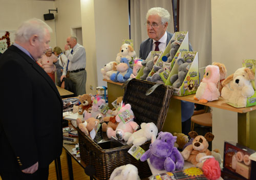 Peter Hegarty, the association secretary buying a microwaveable cuddly soft toy from the stall run by the vice president of the association Malcolm Warren. Peter Hegarty, the association secretary buying a microwaveable cuddly soft toy from the stall run by the vice president of the association Malcolm Warren.