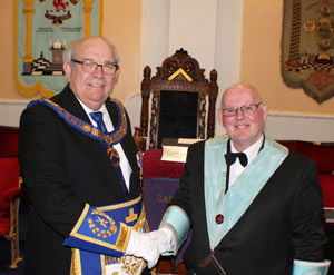 Phil Gunning (left) congratulates John Simpkin on taking the chair at Carnarvon Lodge. Phil Gunning (left) congratulates John Simpkin on taking the chair at Carnarvon Lodge.