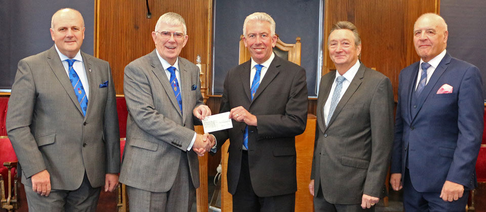 Pictured from left to right, are: David, Tony receiving the cheque from Mark with John and Steve alongside. Pictured from left to right, are: David, Tony receiving the cheque from Mark with John and Steve alongside.