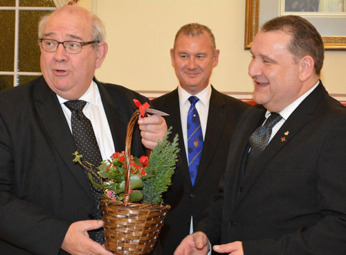 Philip (left) being presented with a flower basket by Darren (right) with Ian (centre) looking on. Philip (left) being presented with a flower basket by Darren (right) with Ian (centre) looking on.