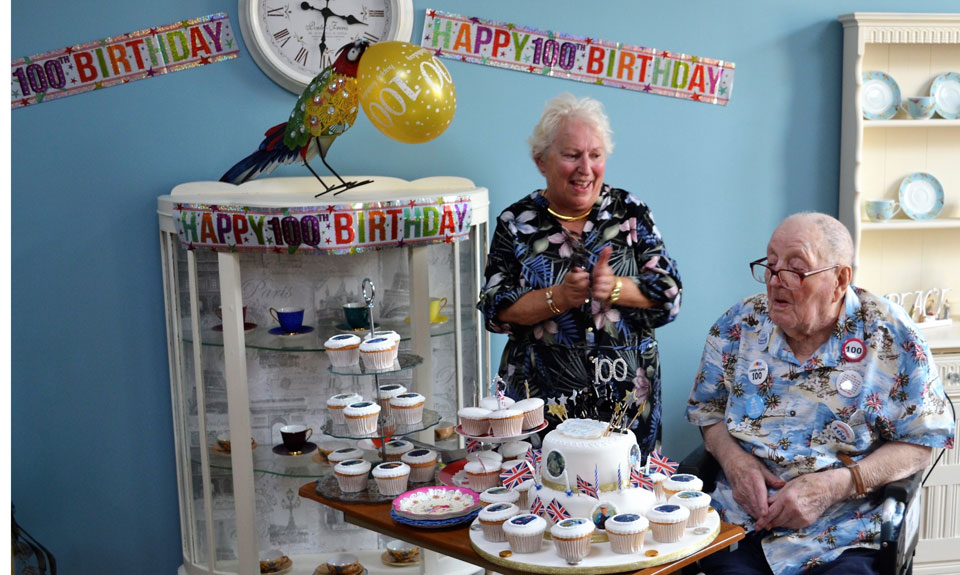 Rita Cheminais (left) and Derek Brear with the birthday cake. Rita Cheminais (left) and Derek Brear with the birthday cake.