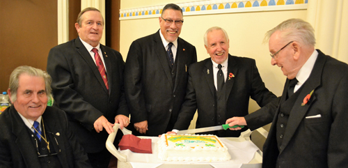 Cutting the cake. Pictured from left to right, are: Dave Jones, Tom McLaughlin, Jorge Perez, Bernie Ashley and Stan Sutch Cutting the cake. Pictured from left to right, are: Dave Jones, Tom McLaughlin, Jorge Perez, Bernie Ashley and Stan Sutch