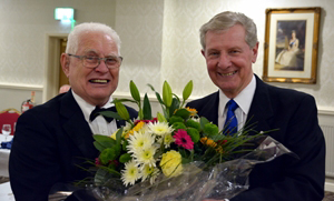 Mike (left) presents a floral gift to Stuart. Mike (left) presents a floral gift to Stuart.