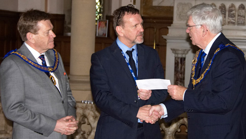 Pictured from left to right Kevin Poynton, John Patterson and presenting the 'Signature Donation', Tony Harrison. Pictured from left to right Kevin Poynton, John Patterson and presenting the 'Signature Donation', Tony Harrison.