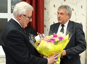 Ian Higham (left) receives flowers from Andrew Harrison. Ian Higham (left) receives flowers from Andrew Harrison.