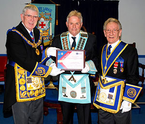 Tony Harrison (left) presenting Eric Moran with the MCF 2021 Festival Patron certificate, with Malcolm Sandywell group charity steward (right). Tony Harrison (left) presenting Eric Moran with the MCF 2021 Festival Patron certificate, with Malcolm Sandywell group charity steward (right).