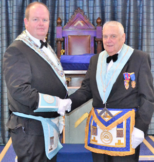 James Hughes (left) being congratulated by Frank Hogarth. James Hughes (left) being congratulated by Frank Hogarth.