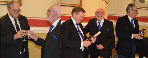 Pictured left: Gwilym Jones singing the master’s song to Paul. Middle: Kevin receiving a bottle of Champagne. Right: Andy receiving his bottle of rum.