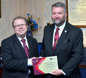 Jayson Jackson (left) receives the Grand Patron Certificate from Allan Shields. Jayson Jackson (left) receives the Grand Patron Certificate from Allan Shields.