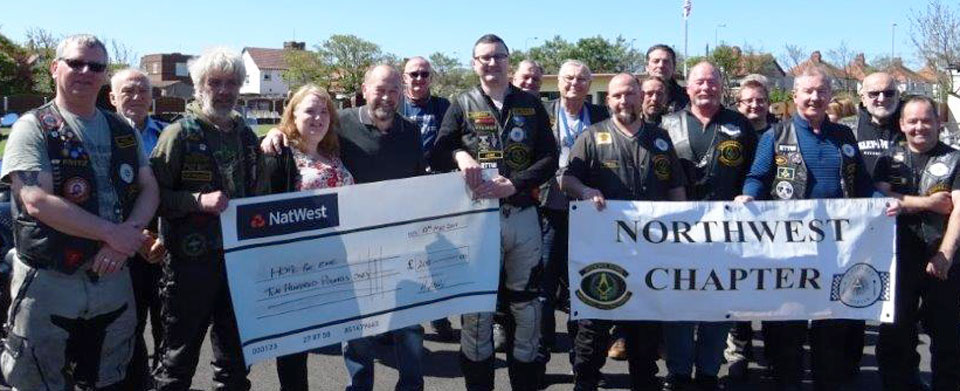 Widows Sons present a cheque to Peter and Julie Maxwell Widows Sons present a cheque to Peter and Julie Maxwell