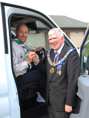 Tony Harrison hands the keys of the minibus to George Binns. Tony Harrison hands the keys of the minibus to George Binns.