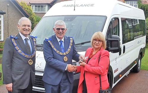 : Pictured from left to right are: Stephen Blank and Tony Harrison handing the keys for the ambulance to Sylvia Short. : Pictured from left to right are: Stephen Blank and Tony Harrison handing the keys for the ambulance to Sylvia Short.