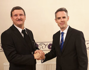 David (right) congratulates Peter on taking the chair.