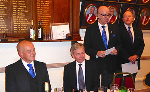 Pictured from left to right, seated are: Graham Fairley and Stephen White. Standing: Steven Williams proposing the toast to the new WM, attended by Malcolm Bell. Pictured from left to right, seated are: Graham Fairley and Stephen White. Standing: Steven Williams proposing the toast to the new WM, attended by Malcolm Bell.