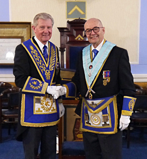 Stuart Thornber (left) congratulates Dr Graham Hoadley. Stuart Thornber (left) congratulates Dr Graham Hoadley.