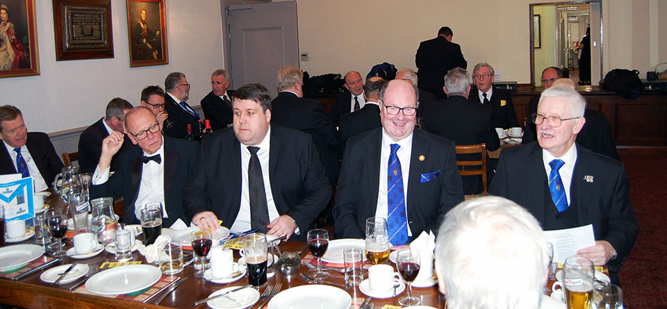 At the festive board. At the festive board.