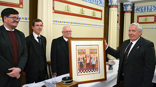 The presentation of a framed picture, ‘The three principals’, from the chapter’s three principals to hall director Roy Ashley.