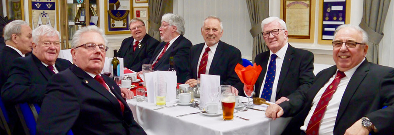Companions enjoying the festive board with some museum exhibits in the background. Companions enjoying the festive board with some museum exhibits in the background.