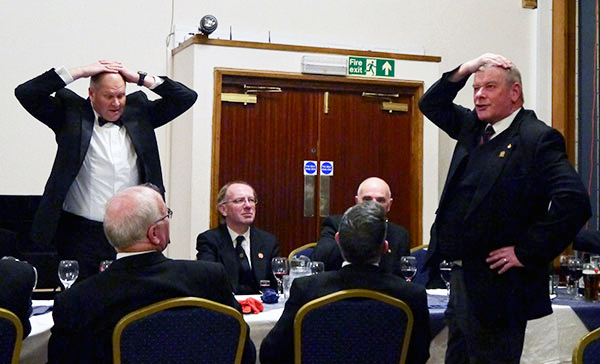 Brethren playing the game ‘heads or tails’ to win a bottle of whiskey. Brethren playing the game ‘heads or tails’ to win a bottle of whiskey.