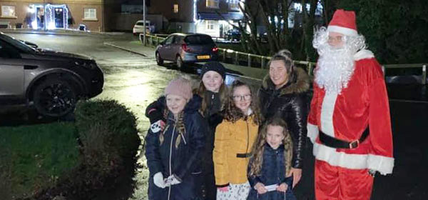 One family surprised and delighted with Santa. One family surprised and delighted with Santa.