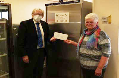 John Wooton presenting the cheque to Margaret Highton John Wooton presenting the cheque to Margaret Highton