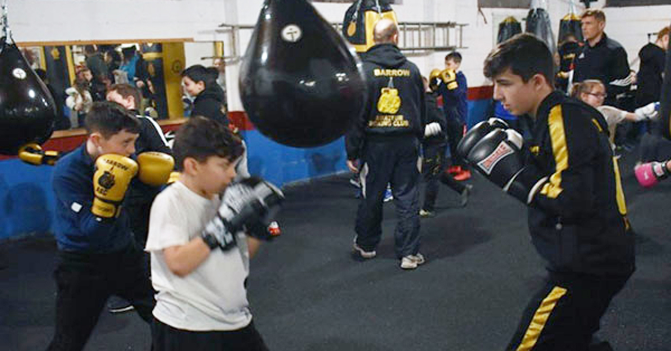 Ethan Holt of Barrow ABC (right) helping coach the next generation of young boxers. Ethan Holt of Barrow ABC (right) helping coach the next generation of young boxers.