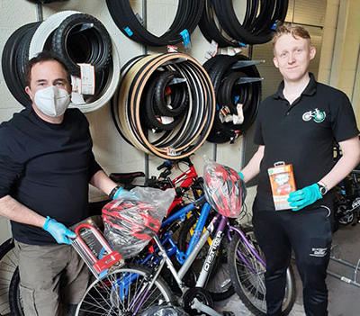 Colin Southern (left) with one of the Bike Works engineers.