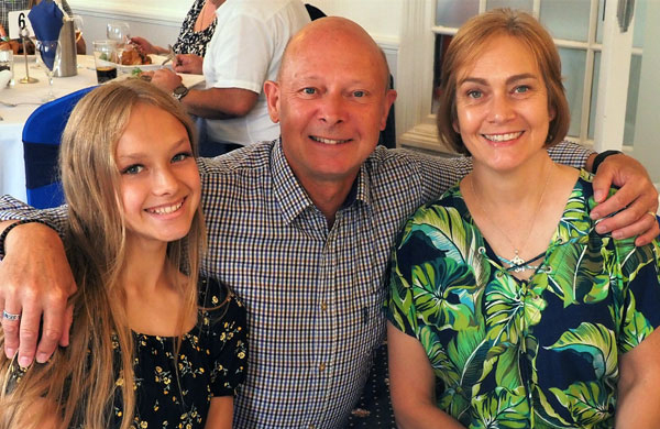 Tim Walton (centre) with his wife and daughter.