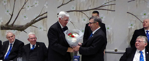 Tony receives flowers for Maureen. Tony receives flowers for Maureen.