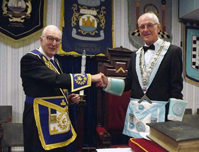 Peter Greathead (left) congratulates the new master, Ken Rennison. Peter Greathead (left) congratulates the new master, Ken Rennison.