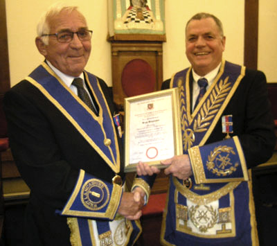  Brian being presented with his commemorative certificate by Chris Eyres.