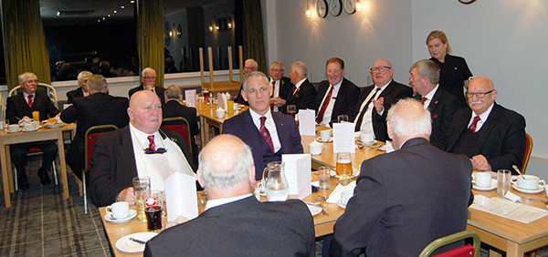 At the festive board. At the festive board.