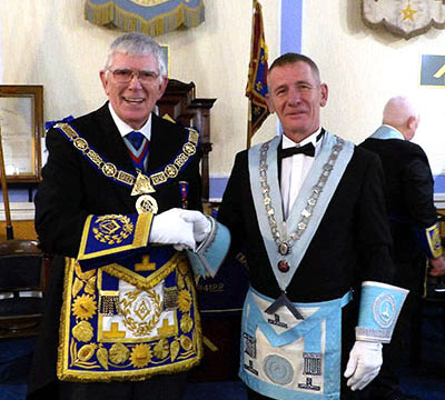 Provincial Grand Master Tony Harrison (left) congratulates WM Jimmy Wilkes. Provincial Grand Master Tony Harrison (left) congratulates WM Jimmy Wilkes.