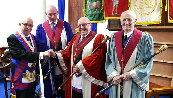 Pictured from left to right, are: Malcolm Alexander congratulating the three principals, Ray Thain, Terry Ford and Alan Scott.