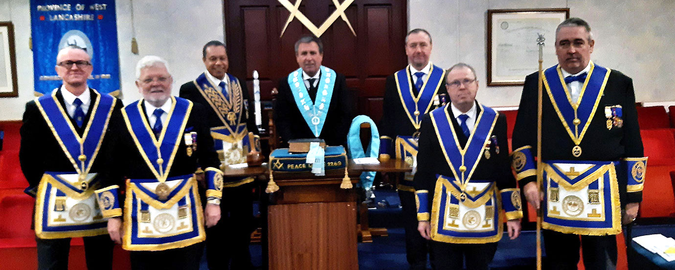 John Gibbons (centre) accompanied by Andy Wiltshire (third left) and the acting Provincial grand officers.