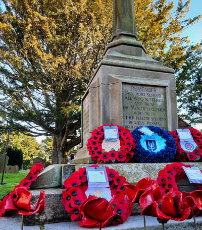 Poppy wreaths laid on the war memorial.