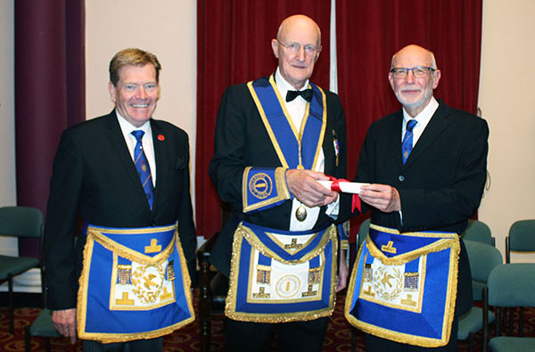 John McGibbon receives his jubilee certificate, pictured from left to right, are: Kevin Poynton, John McGibbon and John James.
