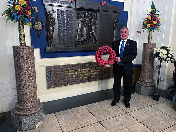 Ray Marshall with the wreath for his fallen brother Tony Marshall RN. Ray Marshall with the wreath for his fallen brother Tony Marshall RN.